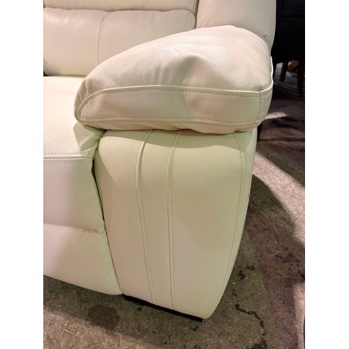 3087 - A cream leather armchair