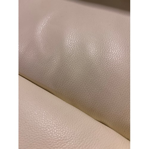 3087 - A cream leather armchair