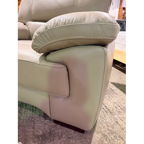 3089 - A taupe leather armchair