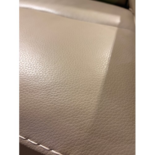 3089 - A taupe leather armchair