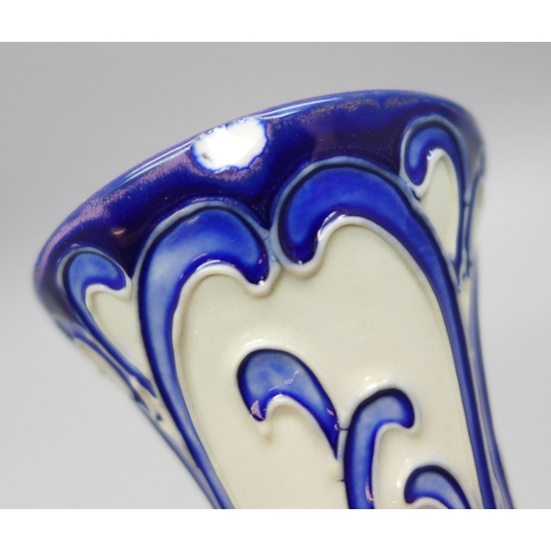 2006 - A Moorcroft blue and white vase, marked Trial 27.2.19, glazed chip to the rim, 16cm