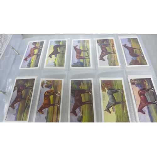 2016 - A collection of forty-five complete reproductions of early 1900s cigarette card sets in two albums a... 