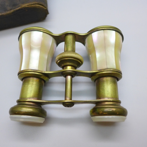 2020 - A pair of brass and mother of pearl opera glasses, complete with leather case