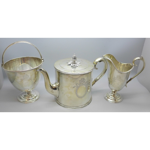 7301 - A Victorian silver tea service with monogram - a tea pot (with two ivory sections to handle), 612g, ...