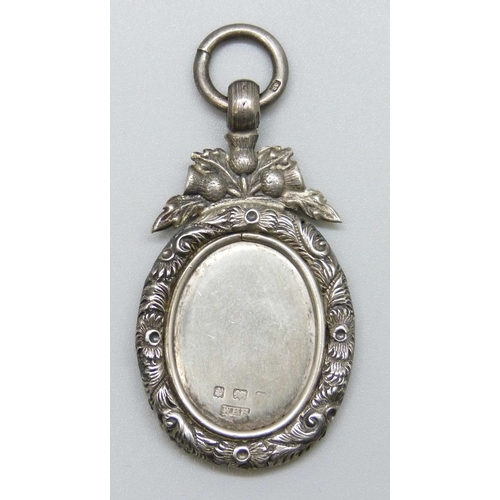 7025 - A silver fob pendant with Scottish style thistle design, WHH, Birmingham, date letter worn, 4.8cm in... 