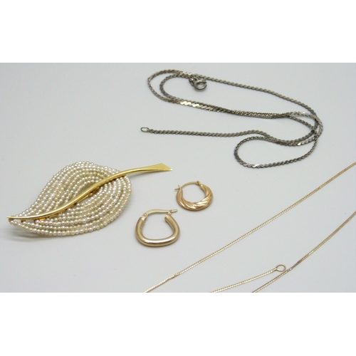 7058 - A 14ct gold chain, 1.2g, together with two 9ct gold hoop earrings, 0.6g, two silver chains, a bracel... 