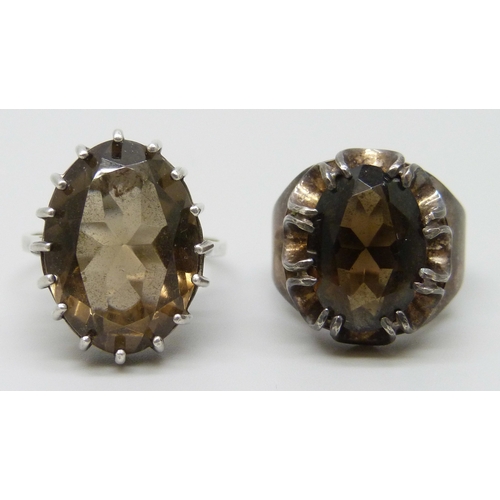 7117 - Two hallmarked silver and smoky quartz rings, 8g, larger stone example size P, the other size K