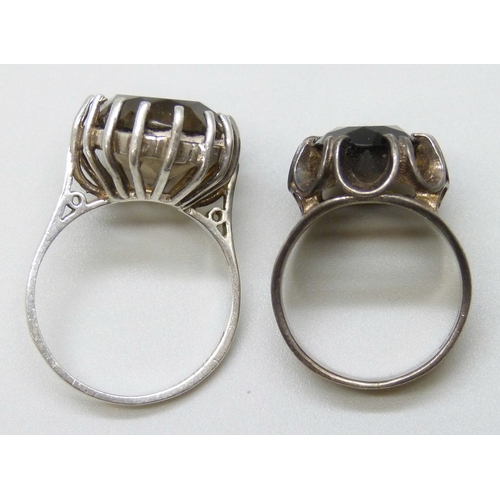 7117 - Two hallmarked silver and smoky quartz rings, 8g, larger stone example size P, the other size K