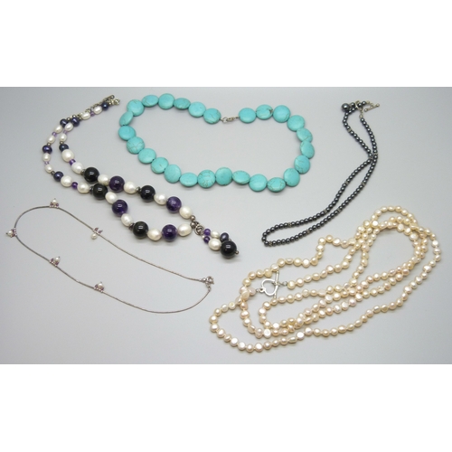 7122 - A large pearl and amethyst necklace, a hematite necklace with a white metal clasp, tests as silver, ... 