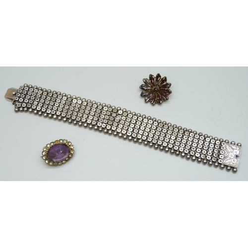 7138 - A Victorian white metal bracelet, a/f, 34g, 18.5cm, and two paste brooches