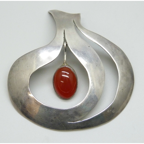 7139 - A statement Modernist white metal pendant set with a carnelian drop, 7.4cm, 18g