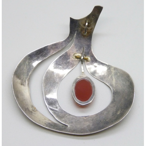 7139 - A statement Modernist white metal pendant set with a carnelian drop, 7.4cm, 18g