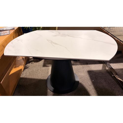 3070 - A stone top circular extending dining table