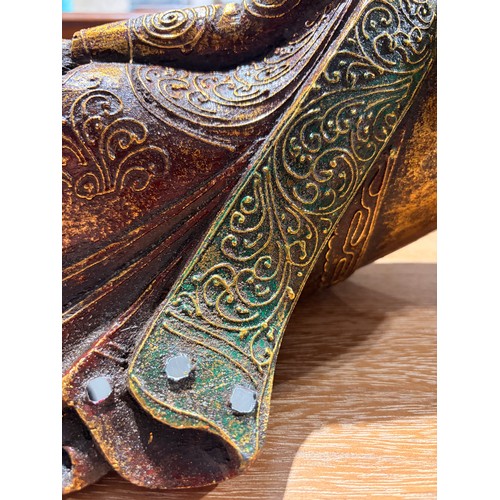 3092 - A wooden laying eastern deity decoration