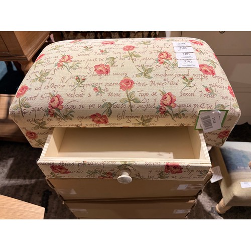 3102 - A small floral patterned footstool with a drawer