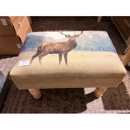 3107 - A small stag print footstool