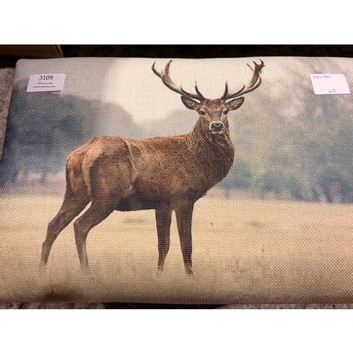 3109 - A small stag print footstool