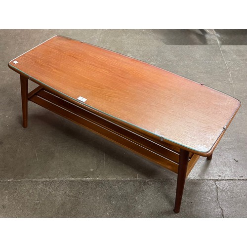 78 - A teak and glass topped rectangular coffee table
