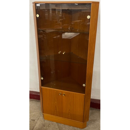 86 - A Turnidge of London teak freestanding corner cabinet