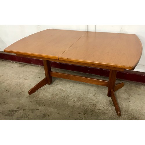 91 - A teak rectangular extending dining table