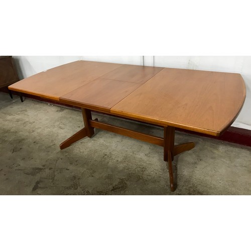 91 - A teak rectangular extending dining table