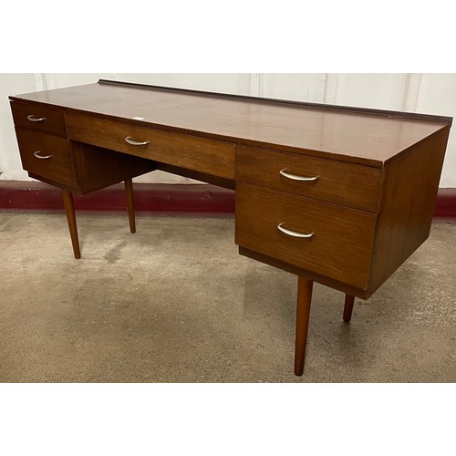 54 - A Stag S-Range afromosia desk, designed by John and Sylvia Reid