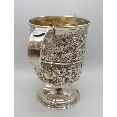 7001 - A George III silver two handled loving cup with embossed floral decoration, J Robertson & D Darling,... 