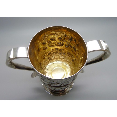 7001 - A George III silver two handled loving cup with embossed floral decoration, J Robertson & D Darling,... 