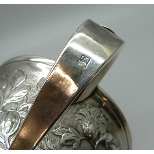 7001 - A George III silver two handled loving cup with embossed floral decoration, J Robertson & D Darling,... 