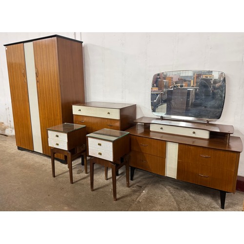 100 - A teak and white painted five piece bedroom suite, consisting of wardrobe, dressing table, chest of ... 