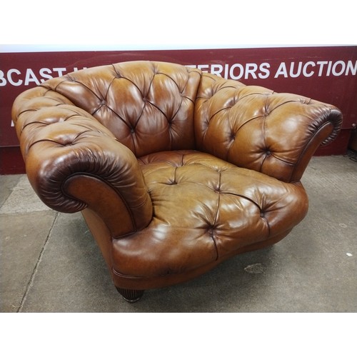 102A - A Regency style Tetrad tan leather Chesterfield armchair