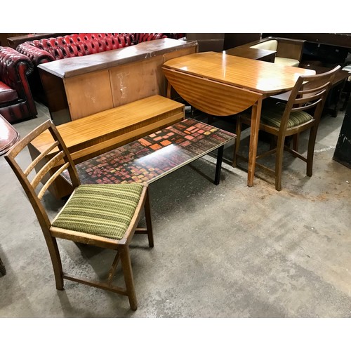 99 - A teak drop-leaf table, two chairs, a media unit and a Formica topped coffee table