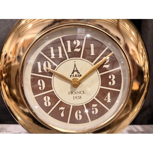 3026 - A Minster gold effect mantle clock on a circular black marble base