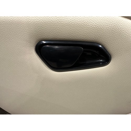 3082 - A cream leather swivel/manual reclining chair with footstool