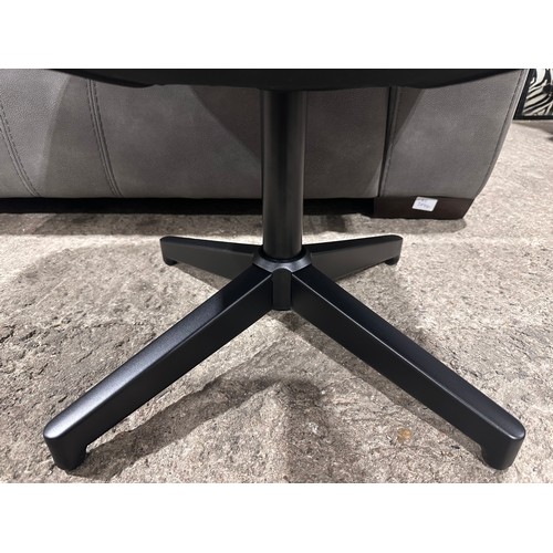 3082 - A cream leather swivel/manual reclining chair with footstool