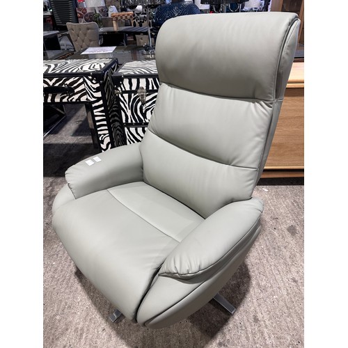 3083 - A grey leather swivel/ manual reclining chair with footstool