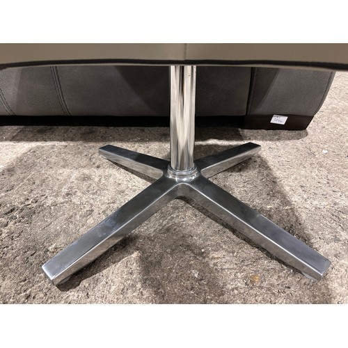 3083 - A grey leather swivel/ manual reclining chair with footstool