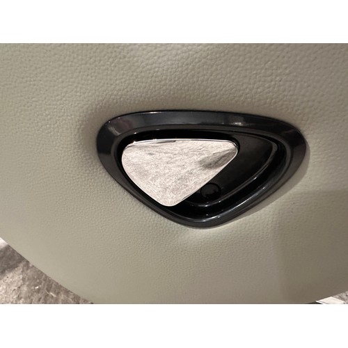 3083 - A grey leather swivel/ manual reclining chair with footstool