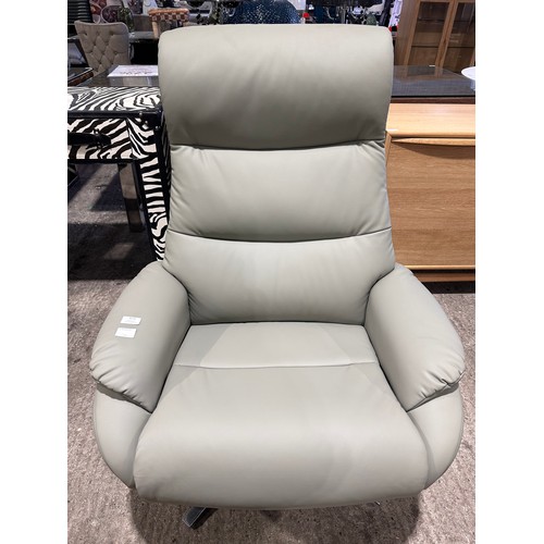 3083 - A grey leather swivel/ manual reclining chair with footstool