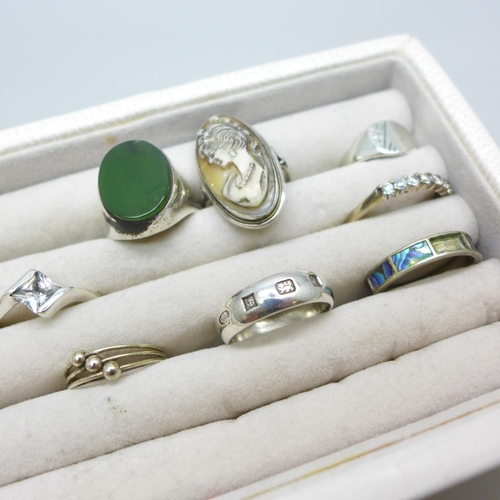 Seven silver rings and two plated rings