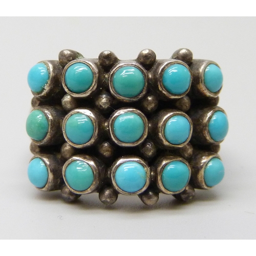 7103 - A Doug Paulus silver and turquoise ring, M/N