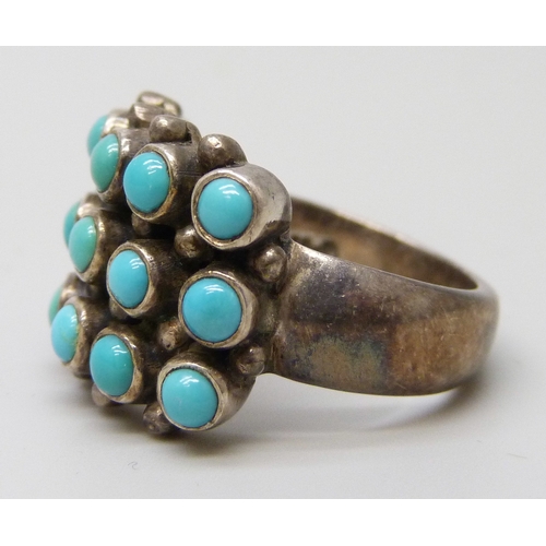 7103 - A Doug Paulus silver and turquoise ring, M/N