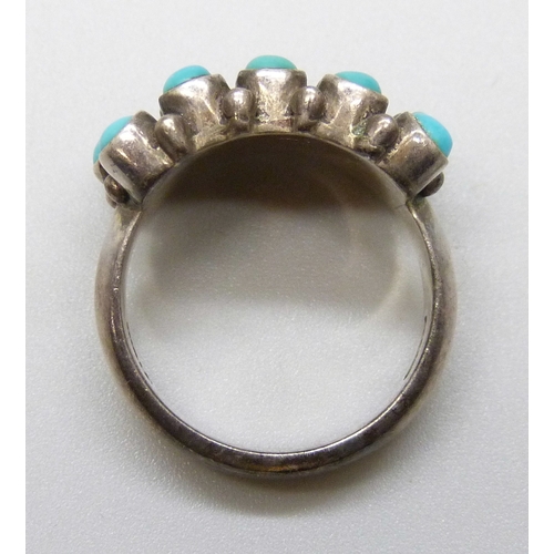 7103 - A Doug Paulus silver and turquoise ring, M/N