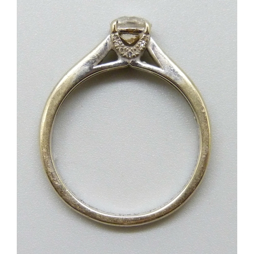 7112 - An 18ct white gold natural diamond ring, the central stone 0.6ct, with diamond set shoulders, 3.8g, ... 