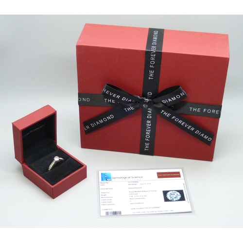 7112 - An 18ct white gold natural diamond ring, the central stone 0.6ct, with diamond set shoulders, 3.8g, ... 