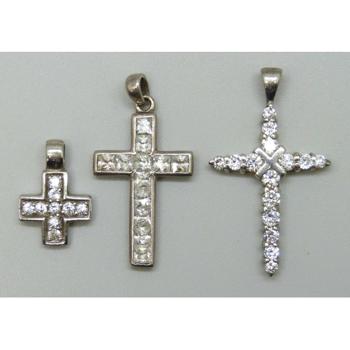 7120 - Three silver and cubic zirconia cross pendants, 8g, largest 3.4cm including bail