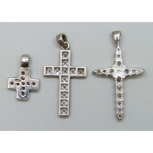 7120 - Three silver and cubic zirconia cross pendants, 8g, largest 3.4cm including bail
