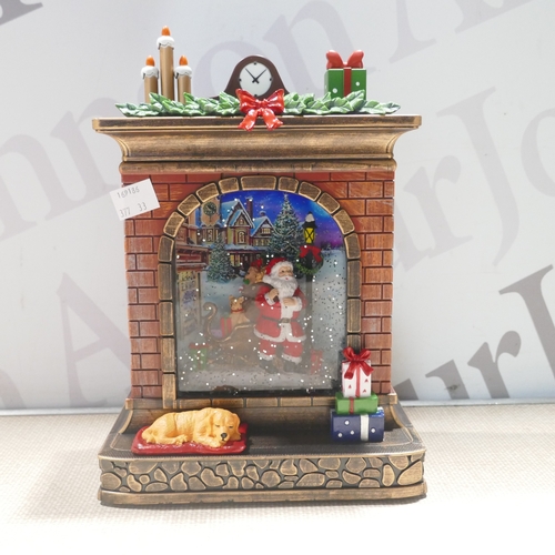6016 - A Fireplace Christmas glitter globe  (377-33) *This lot is subject to VAT