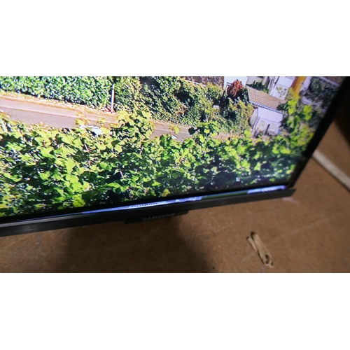 6219 - A Samsung 65” Crystal UHD 4K television with remotes - model no - 65AU9000 (Frame damage/mark on scr... 