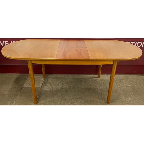 40A - A McIntosh teak oval extending dining table and six chairs